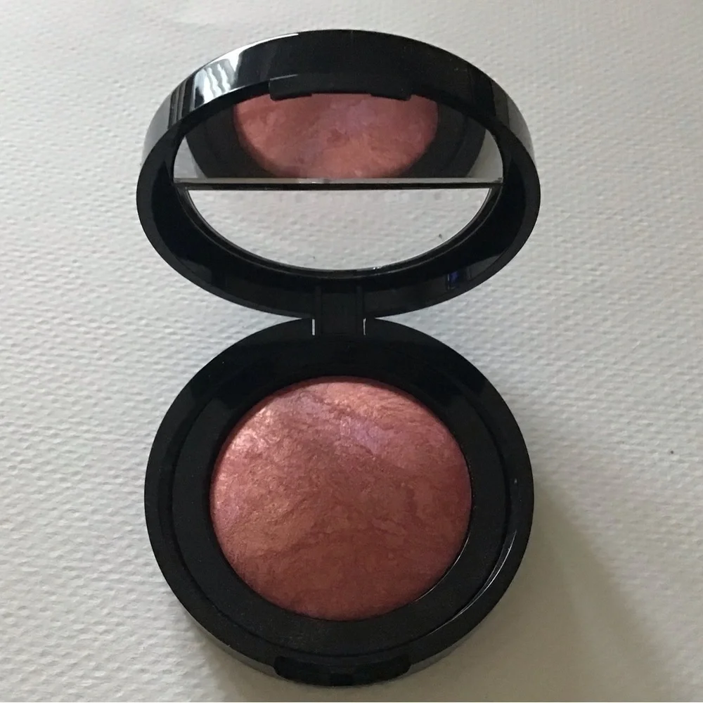 Laura Geller Blush-N-Brighten in TROPIC HUES, swirls of coral, pink, and…